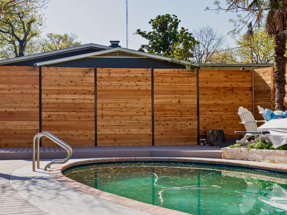 horizontal wood fence during day time